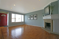 living room has hardwood floors and fireplace